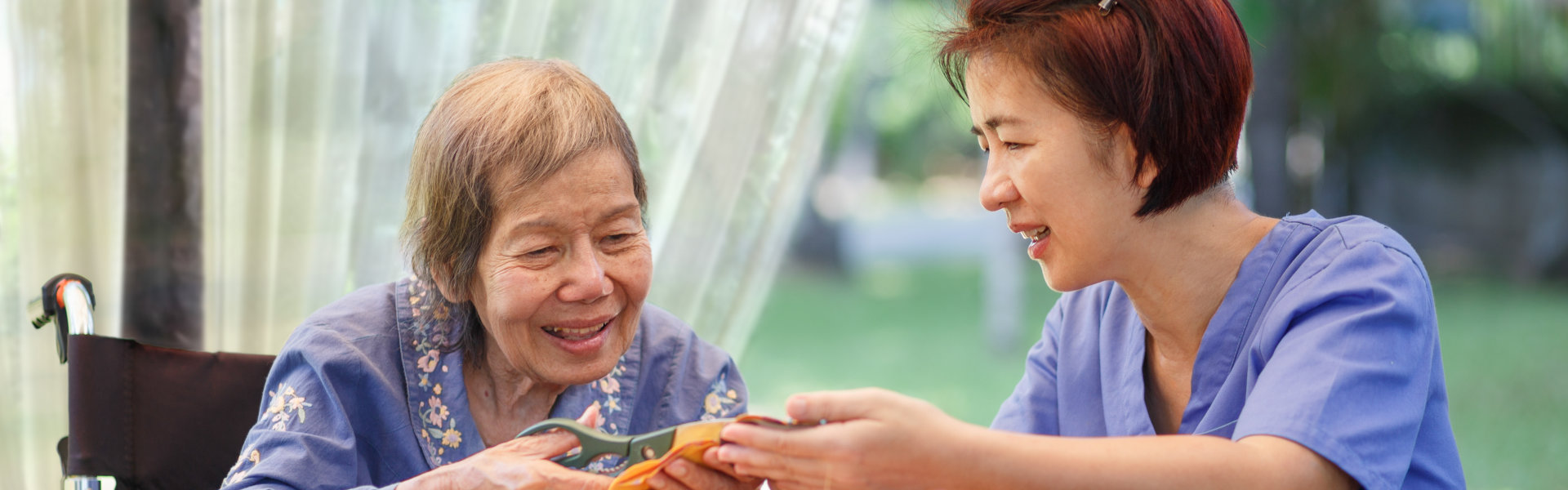 caregiver and elderly smiling